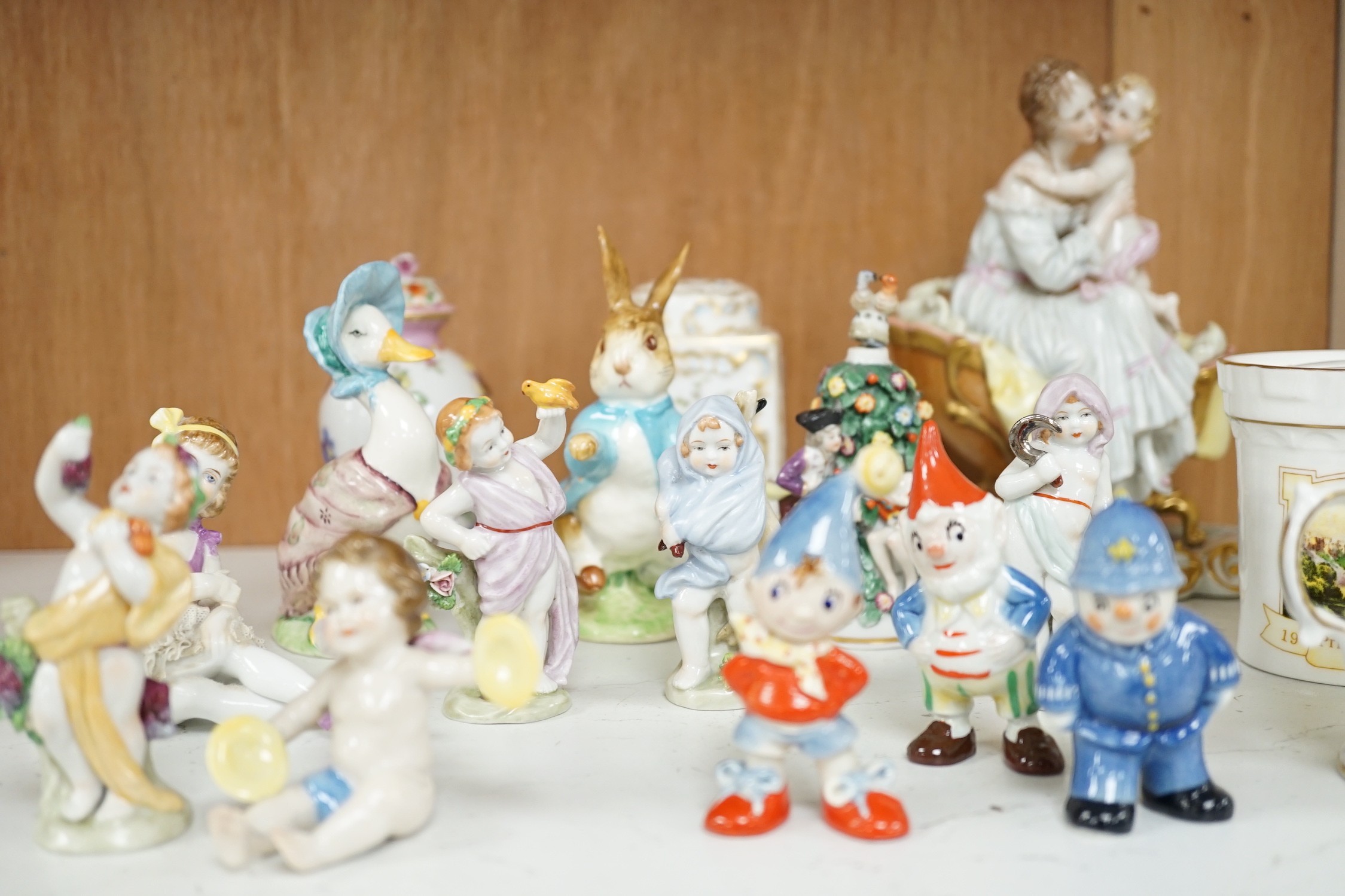 A small group of various porcelain figures etc. including Beatrix Potter and continental porcelain